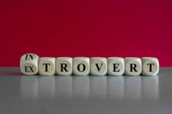 Letter blocks spelling out "introvert" and "extrovert"